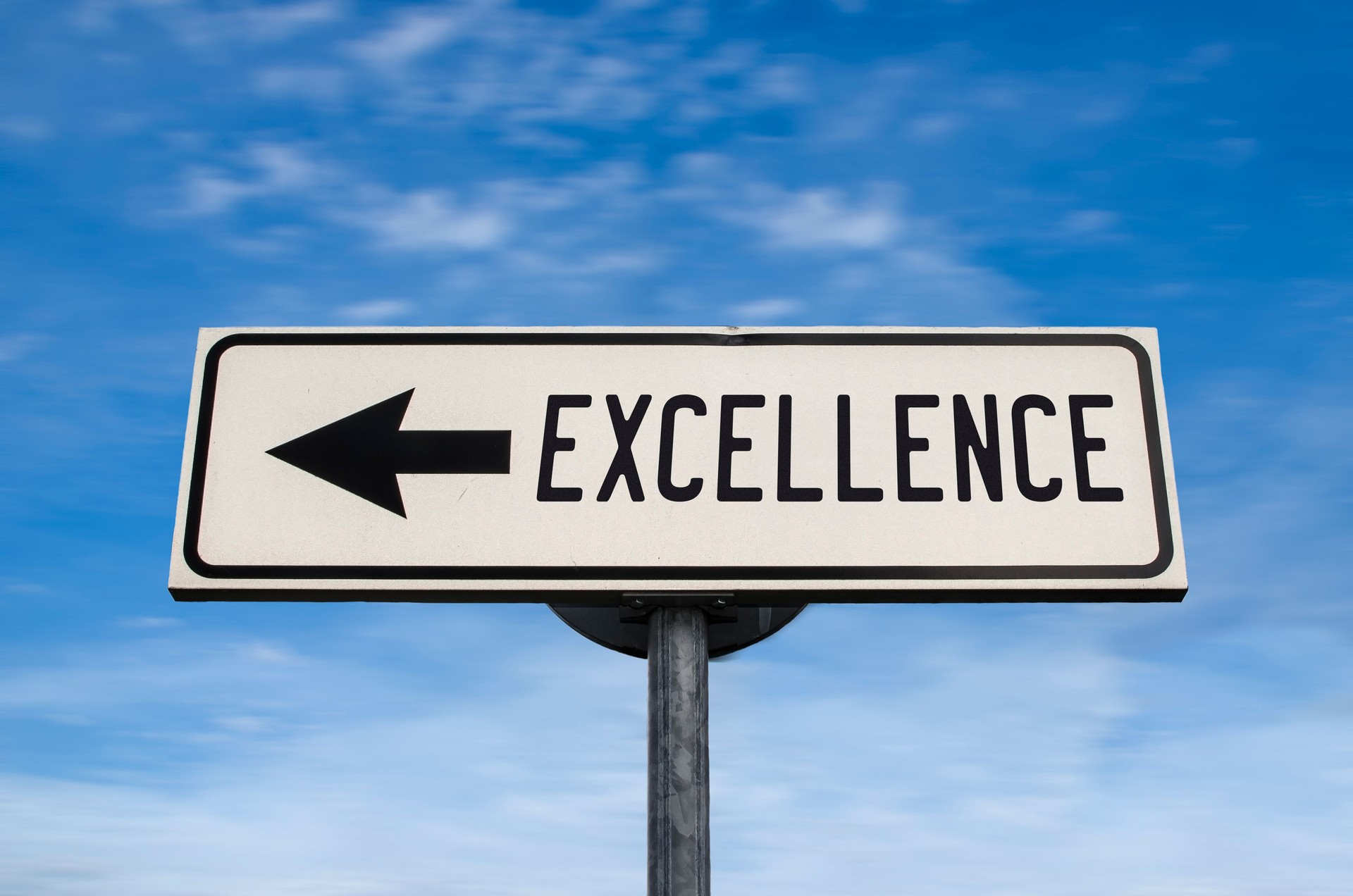 Excellence road sign, arrow on blue sky